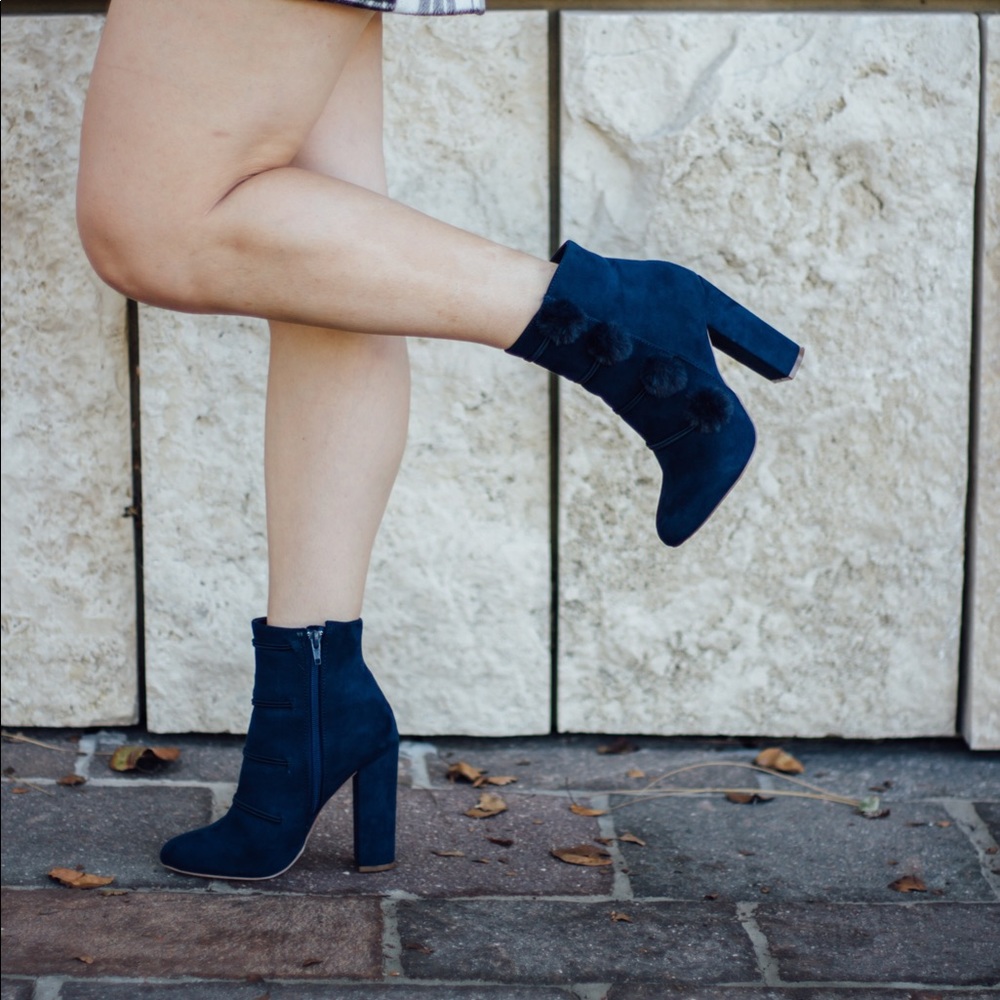 Navy pompom ankle boots